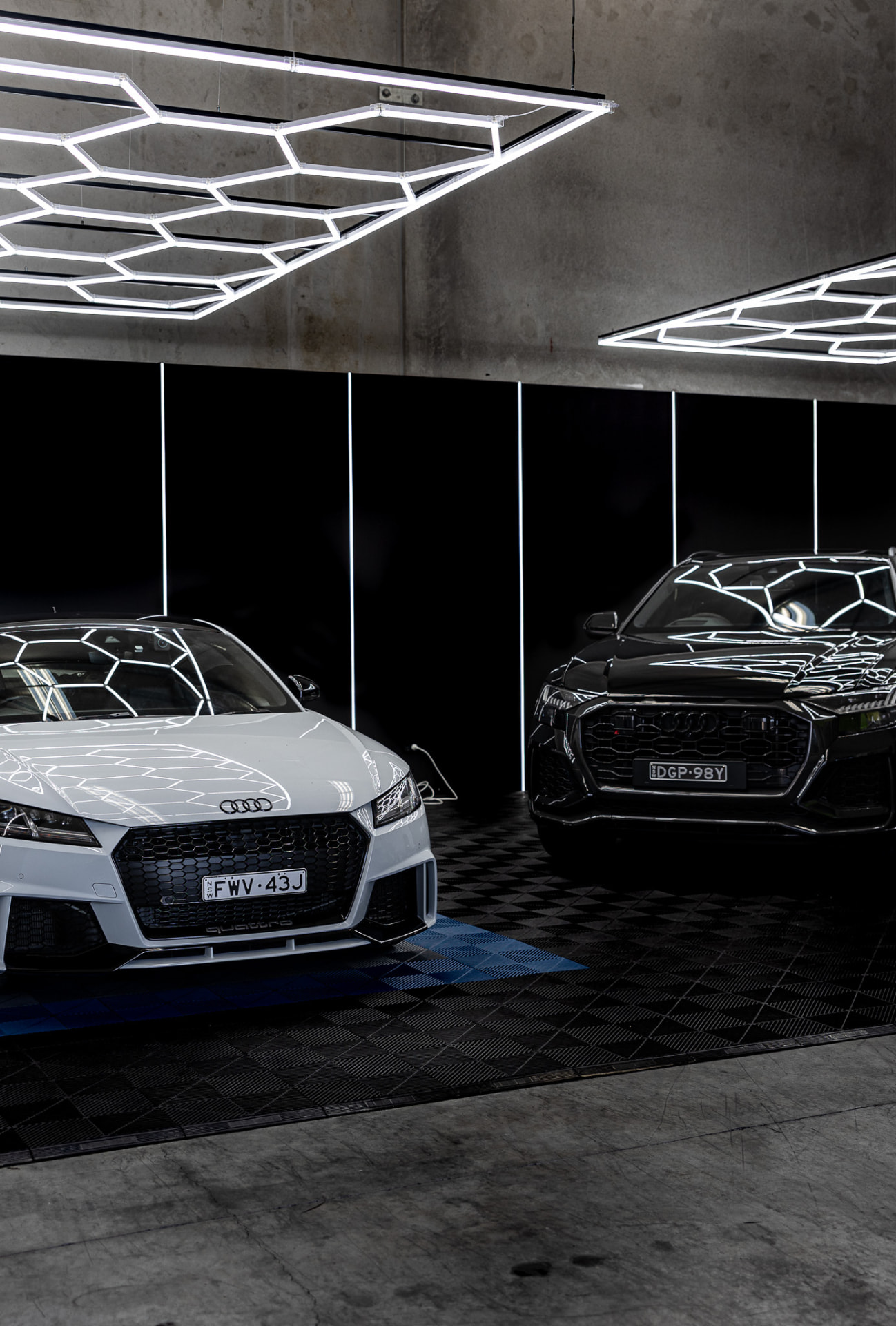 Two customer vehicles inside the Wetherill Park workshop